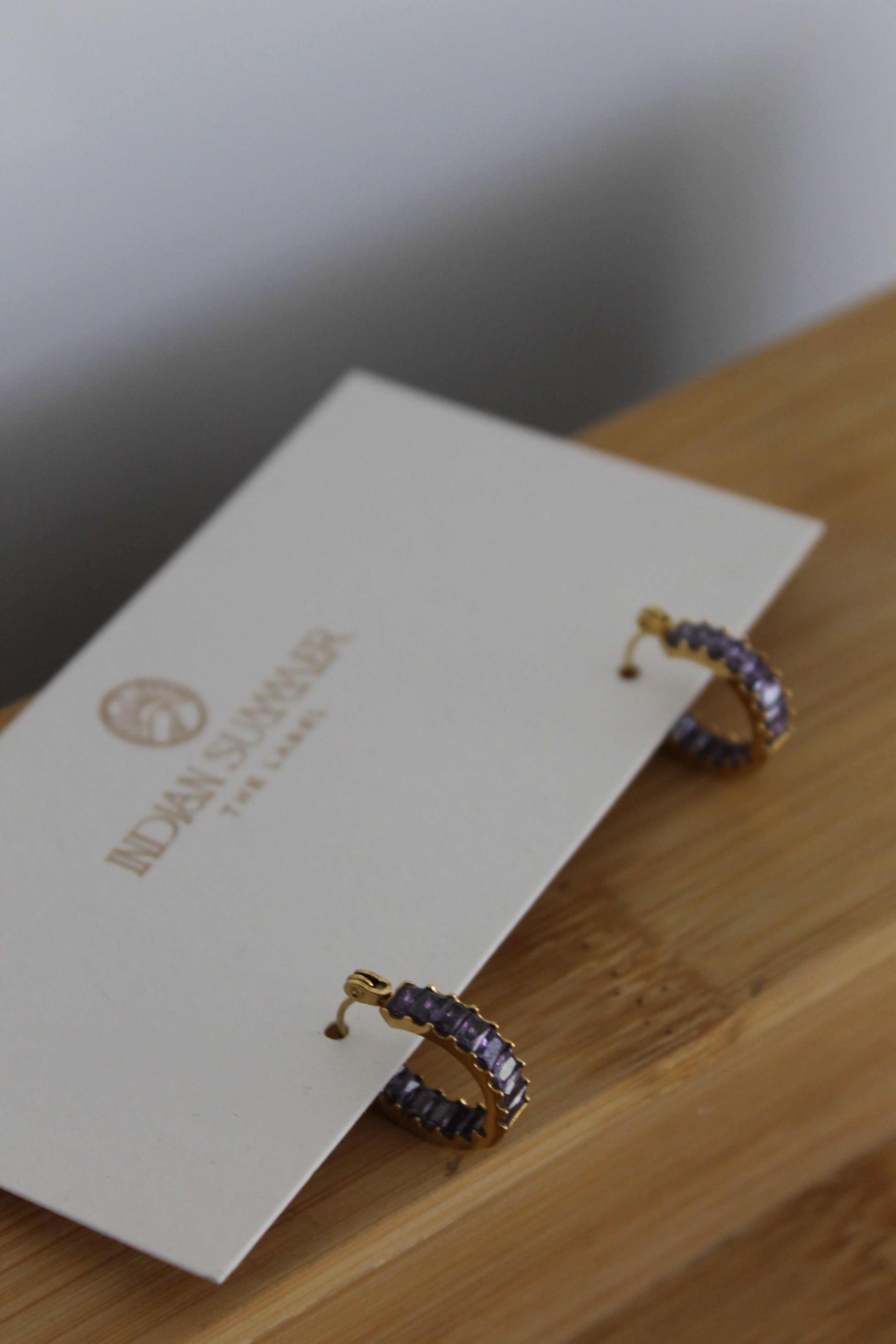 Purple Huggie earrings